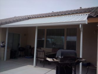 Solid patio cover with slanted roof