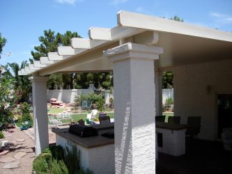 Solid patio cover over outdoor kitchen