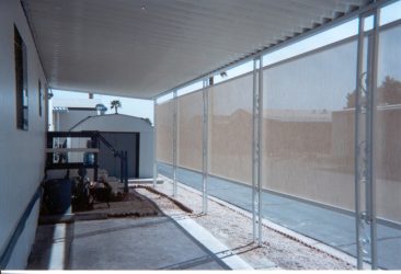 Mobile home carport with privacy screens