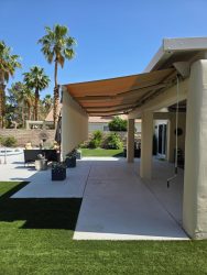Retractable awning extended from existing patio cover