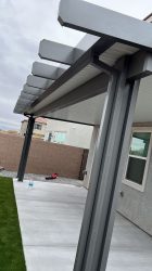 Black patio cover with contrast of white ceiling