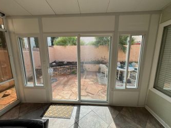 Inside view of patio enclosure with sliding glass door