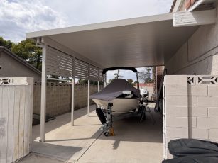 Boat carport cover with privacy shade wall
